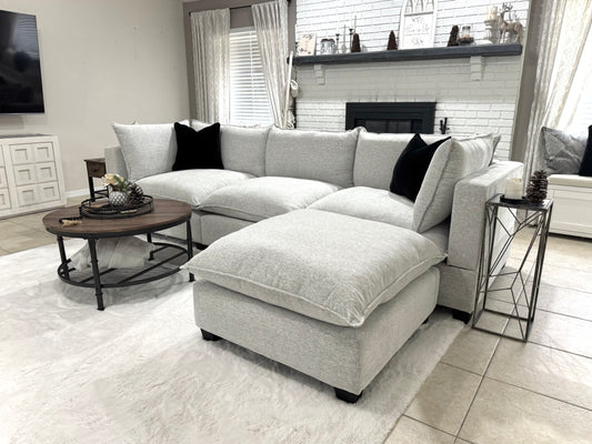 Sofa in a living room with a coffee table and decorative items.