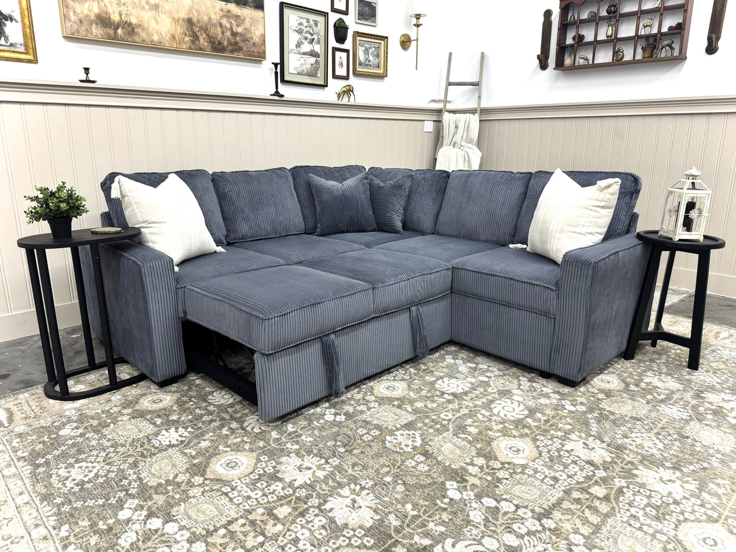 Sectional sofa in a living room setting with decorative elements.