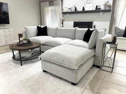 Sofa in a living room with a coffee table and decorative items.
