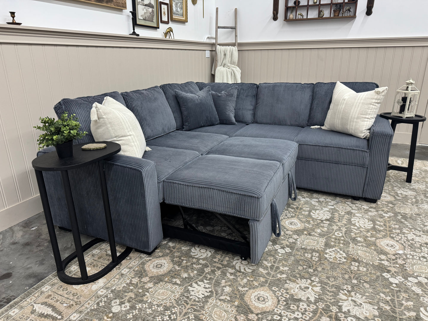 Sectional sofa with ottoman in a living room setting