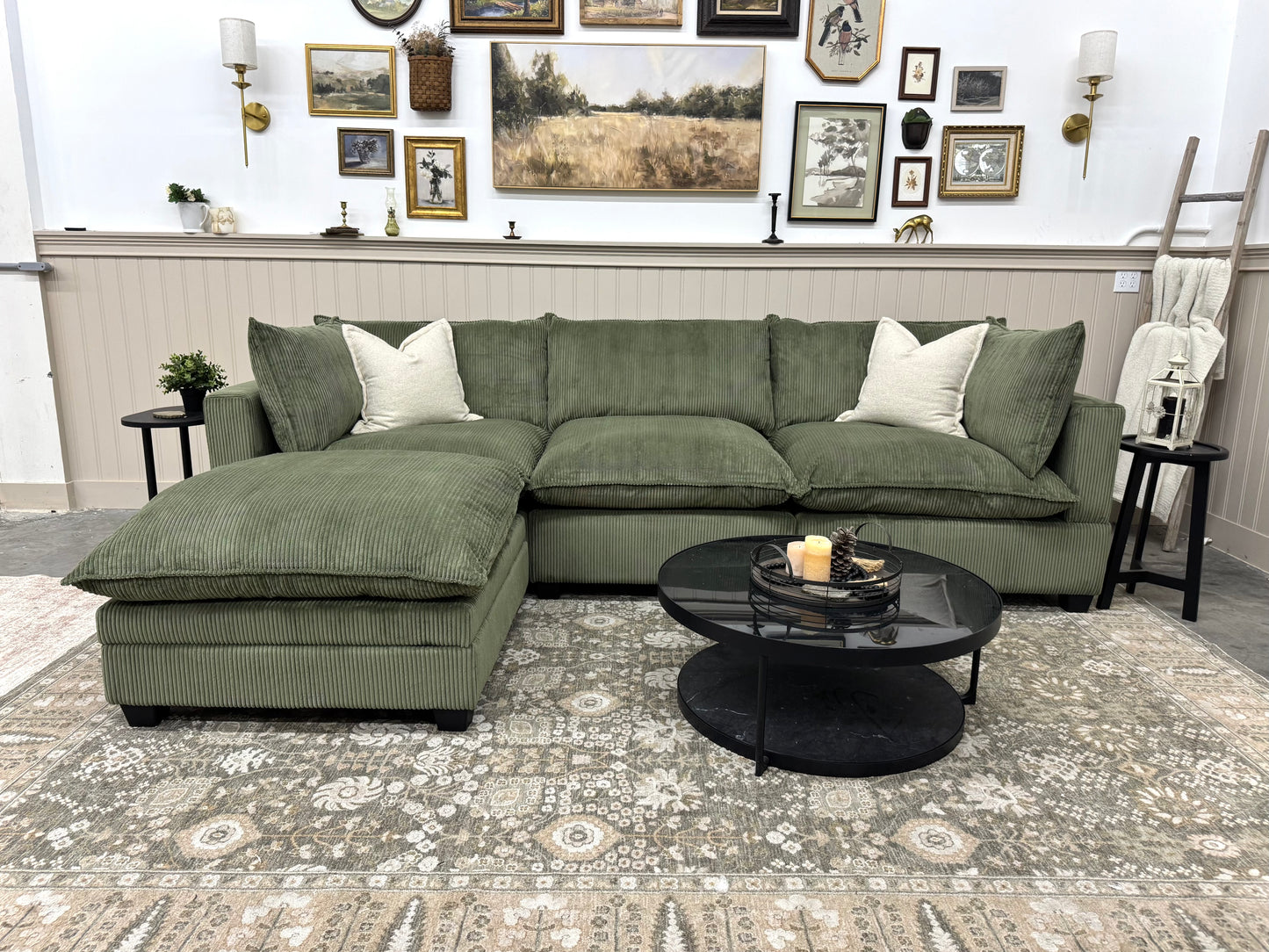 Green sofa in a living room setting with decorative elements.