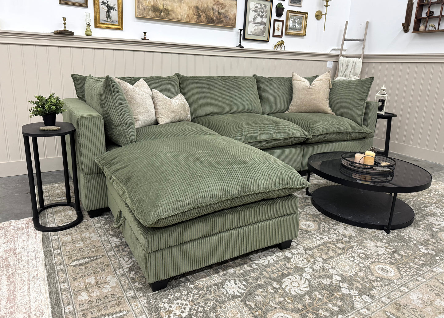 Green sofa in a living room setting with decorative elements.